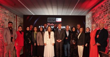  Winners and organizers of KADEM’s “Women and Family” photography contest pose for a group photo at the end of the award ceremony, Istanbul, Türkiye, Oct. 3, 2025. (AA Photo) 
