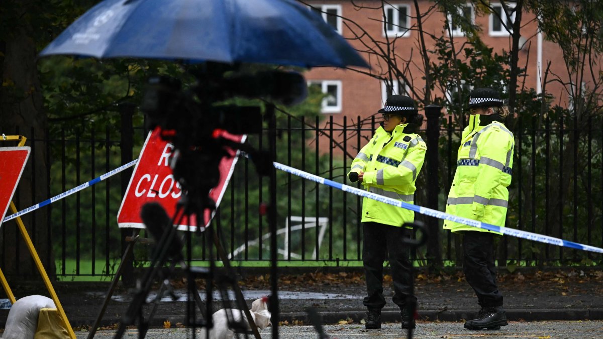 Police officers stand beside equipment from members of the media at the police cordon outside Heaton Park Hebrew Congregation synagogue in Crumpsall, north Manchester, Britain, Oct. 4, 2025. (AFP Photo)