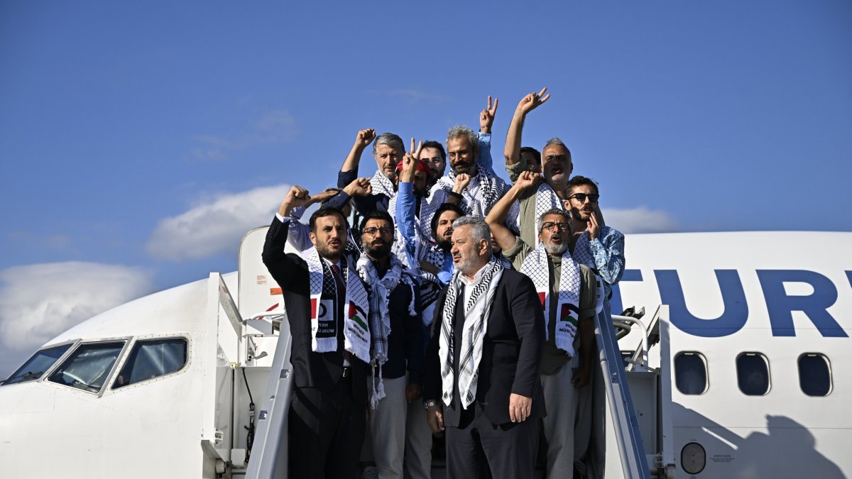 Activists who were detained by Israeli forces while sailing aboard vessels from the Global Sumud Flotilla arrive to Istanbul Airport on a special flight, in Istanbul, Türkiye, Oct. 4, 2025. (Reuters Photo)