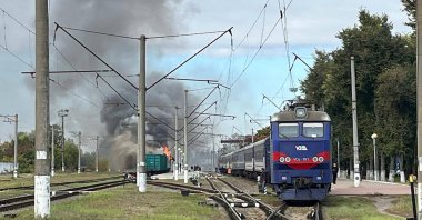 Smoke billows from a burning train carriage following a Russian drone attack in Shostka, Sumy region, Ukraine, Oct. 4, 2025. (AFP Photo)