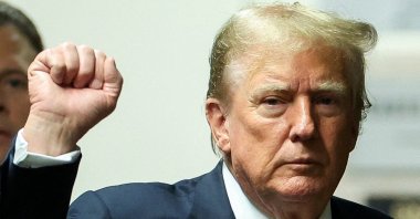Former U.S. President and Republican presidential candidate Donald Trump raises his fist as he arrives for his criminal trial at Manhattan Criminal Court in New York City, U.S., May 29, 2024. (Reuters File Photo)
