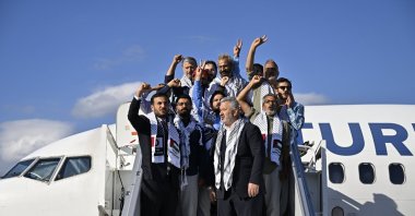 Activists who were detained by Israeli forces while sailing aboard vessels from the Global Sumud Flotilla arrive to Istanbul Airport on a special flight, in Istanbul, Türkiye, Oct. 4, 2025. (Reuters Photo)