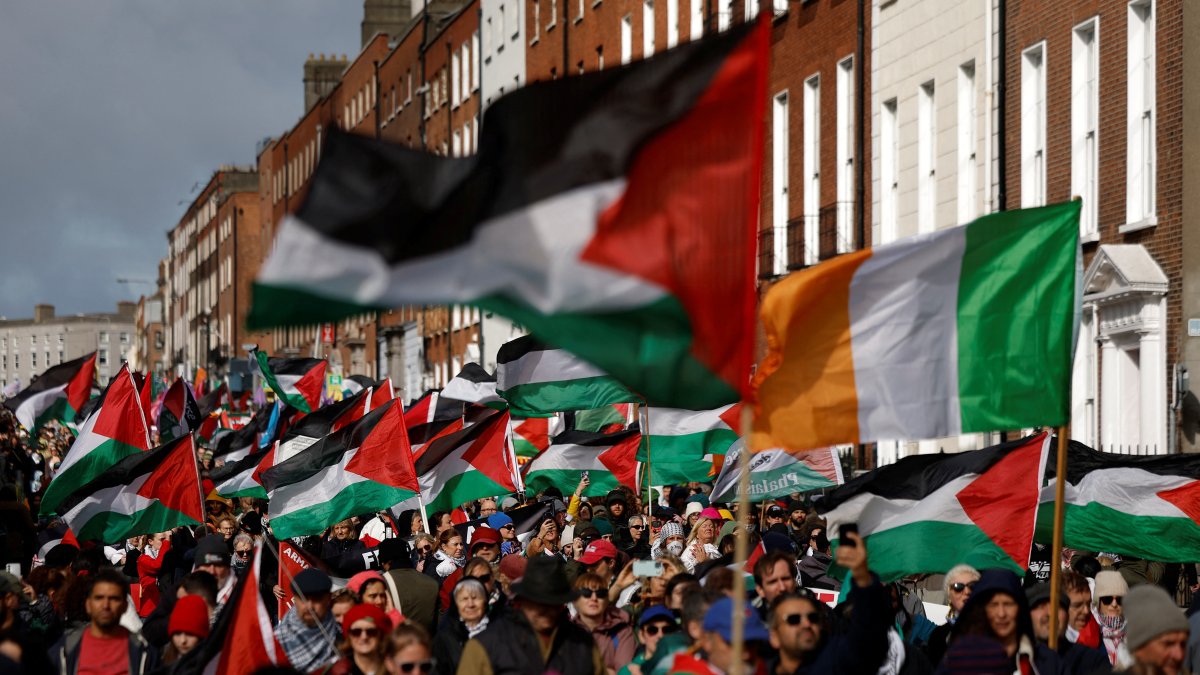 Demonstrators hold flags of Palestine and Ireland to protest the genocide carried out by Israel of the Palestinians, Dublin, Ireland, Oct. 4, 2025. (Reuters Photo)