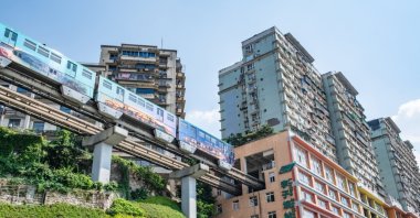 The rail transit Liziba station, which is famed for passing through the floor of a residential building, is seen in Chongqing, China, July 5, 2022. (Shutterstock Photo)