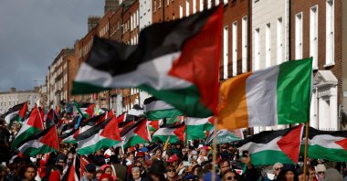 Demonstrators hold flags of Palestine and Ireland to protest the genocide carried out by Israel of the Palestinians, Dublin, Ireland, Oct. 4, 2025. (Reuters Photo)