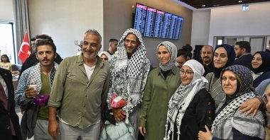 KADEM chairperson Sümeyye Erdoğan Bayraktar (C) and activists from the Global Sumud Flotilla meet at the Istanbul Airport, Istanbul, Türkiye, Oct. 4, 2025. (AA Photo)