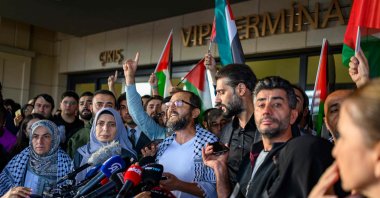Turkish activist Halil Rıfat Çanakcı (C) speaks to the press after arriving with 36 Turks and nationals from 12 countries on a special flight, at Istanbul Airport, Istanbul, Türkiye, Oct. 4, 2025. (AFP Photo)