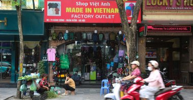 People ride motorbikes past a &quot;Made in Vietnam&quot; shop in Hanoi, Vietnam, Sept. 23, 2025. (EPA Photo)