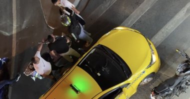 A taxi driver and a motorcyclist argue in a road rage incident, Istanbul, Türkiye, Sept. 17, 2025. (İHA Photo)