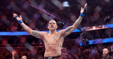 Brazil&#039;s Alex Pereira celebrates defeating UFC light heavyweight champion Magomed Ankalaev, of Russia, during the UFC 320 mixed martial arts bout in Las Vegas, U.S., Oct. 4, 2025. (AP Photo)