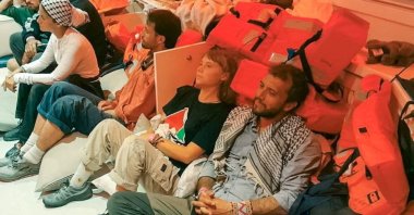 Swedish activist Greta Thunberg and Brazilian activist Thiago Avila sit in a vessel making their way to Israel, after Israel intercepted some of the vessels of the Global Sumud Flotilla aiming to reach Gaza and break Israel&#039;s naval blockade, in this handout image released Oct. 2, 2025. (Reuters Photo)