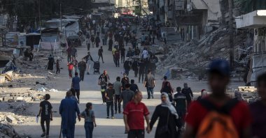 Palestinians walk at Al Remal neighborhood during an Israeli military operation in Gaza City, Gaza Strip, Oct. 5, 2025. (EPA Photo)
