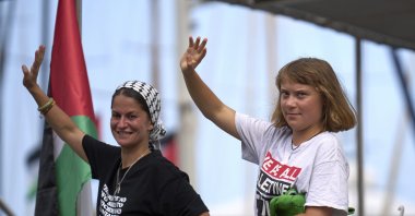 Swedish climate activist Greta Thunberg waves from a boat taking part in a civilian flotilla bound for Gaza, aiming to break the Israeli blockade and deliver humanitarian aid, in Barcelona, Spain, Aug. 31, 2025. (AP Photo)