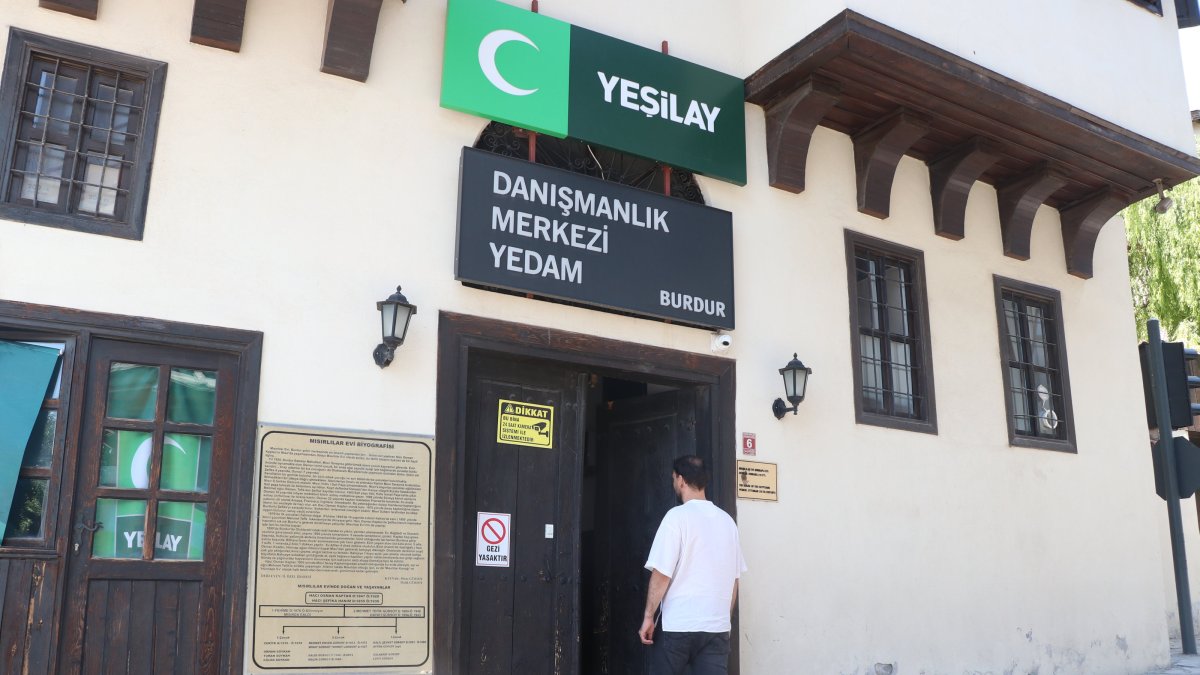 M.B. enters the Green Crescent Counseling Center (YEDAM) building, where he received treatment and now attends workshops, Burdur, Türkiye, Oct. 5, 2025. (AA Photo)