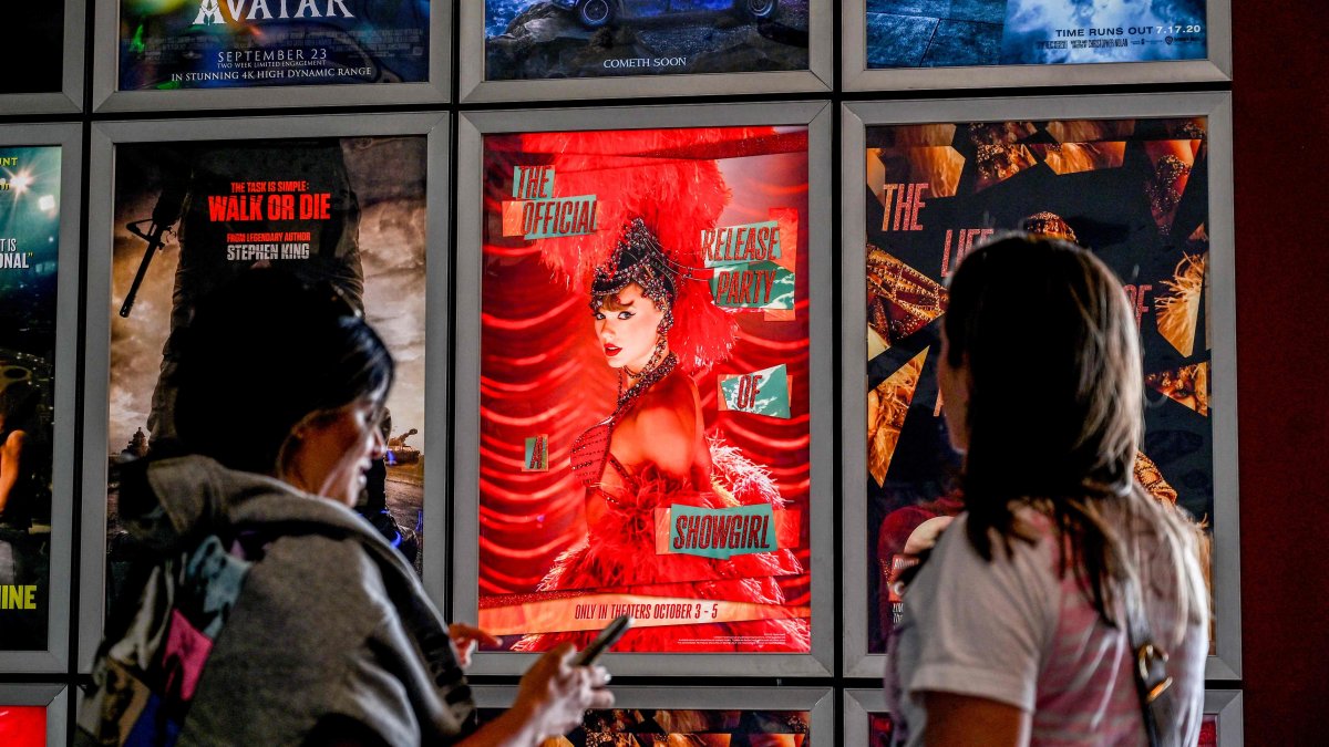 Fans take pictures in the lobby as they attend &quot;Taylor Swift: The Official Release Party of a Showgirl,&quot; AMC Montgomery 16 movie theater, Bethesda, Maryland, U.S., Oct. 3, 2025. (AFP Photo)
