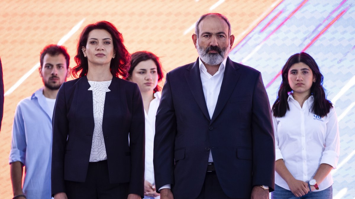 Armenian Prime Minister Nikol Pashinyan and wife Anna Hakobyan attend a rally in his support prior to upcoming parliamentary elections in the center Yerevan, Armenia, June 17, 2021. (AP Photo)