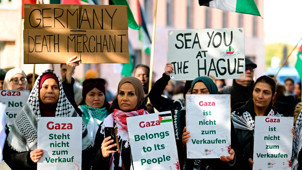 Demonstrators hold posters reading &quot;Gaza is not for Sale&quot; and &quot;Gaza belongs to its people&quot; during a protest titled &quot;Stop the genocide in Gaza&quot; in front of the Foreign Ministry in Berlin, Germany, Oct. 6, 2025. (AFP Photo)