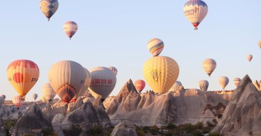 Hot air balloons fill the sky over Cappadocia as Chinese tourists explore the region during Golden Week, Cappadocia, Nevşehir, Türkiye, Oct. 2, 2025. (AA Photo)