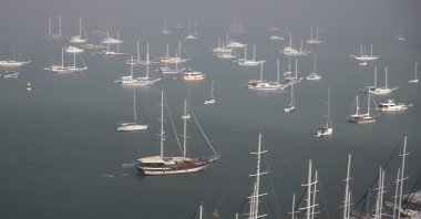 Boats float on the sea under foggy and rainy weather, Fethiye, Muğla, Türkiye, Oct. 3, 2025. (AA Photo)