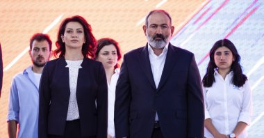 Armenian Prime Minister Nikol Pashinyan and wife Anna Hakobyan attend a rally in his support prior to upcoming parliamentary elections in the center Yerevan, Armenia, June 17, 2021. (AP Photo)