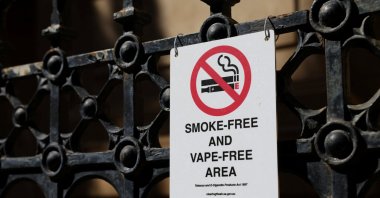 A government notice outlining smoking and vaping restrictions is displayed outside a building in Adelaide, Australia, Sept. 18, 2025. (Reuters Photo)
