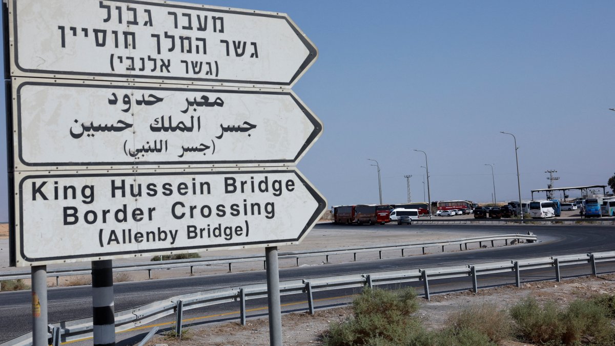 Road signs are pictured as Palestinians wait near the Allenby Bridge Crossing in the Israeli-occupied West Bank, Palestine, Sept. 26, 2025. (Reuters Photo)
