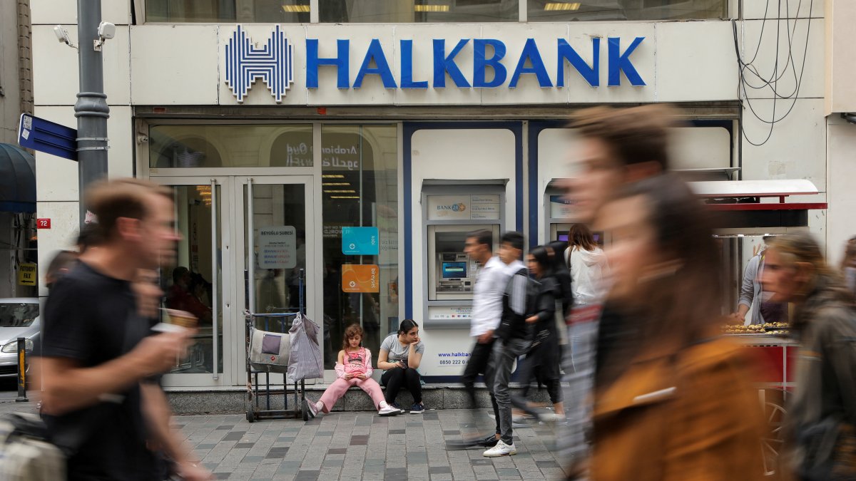 People walk past a branch of Halkbank, Istanbul, Türkiye, Oct. 16, 2019. (Reuters Photo)