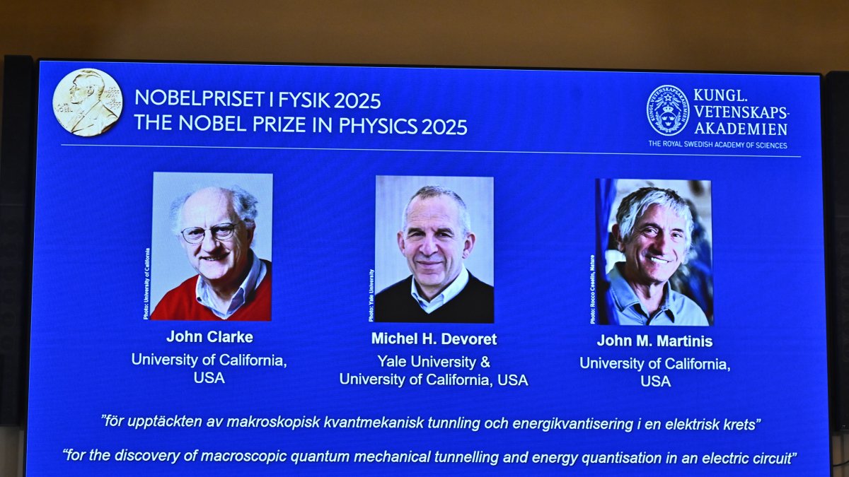 Photos of John Clarke, Michel H Devoret and John M. Martinis are pictured on a screen after they were announced as winners of the Nobel Prize in Physics, at the Nobel Assembly of the Karolinska Institutet, Stockholm, Sweden, Oct. 7, 2025. (AP Photo)