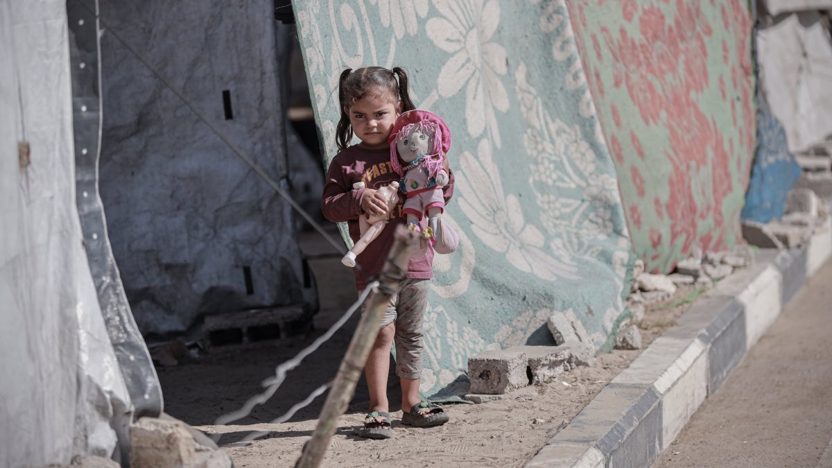 A Palestinian girl stands in front of a tent after being displaced by Israel&#039;s genocidal war in Gaza, Palestine, Oct. 7, 2025. (AA Photo)