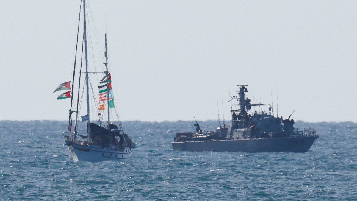 An Israeli navy vessel escorts a vessel from the Global Sumud Flotilla to Ashdod Port, after unlawfully intercepting the vessels of the Flotilla aiming to reach Gaza and break Israel&#039;s naval blockade, in southern Israel, Oct. 2, 2025. (Reuters Photo)
