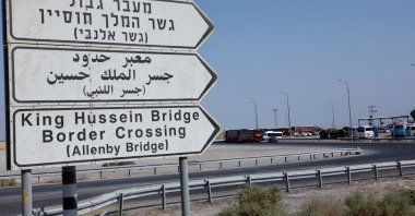 Road signs are pictured as Palestinians wait near the Allenby Bridge Crossing in the Israeli-occupied West Bank, Palestine, Sept. 26, 2025. (Reuters Photo)