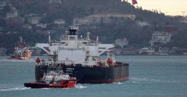 The Liberia-flagged tanker Peria is escorted by a Turkish coastal safety boat as it transits the Bosporus, Istanbul, Türkiye, Jan. 21, 2024. (Reuters Photo)
