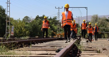 High school students are seen inspecting rails close to a historic train station, Erzincan, eastern Türkiye, Sept. 22, 2025. (AA Photo)
