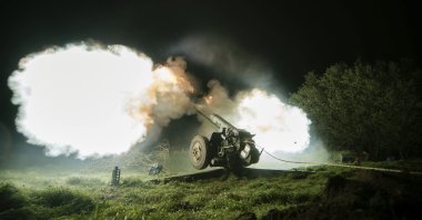 Ukrainian servicemen fire from a 122mm artillery cannon towards Russian positions in Kherson region, Ukraine, Sunday Oct. 27, 2024. (AP Photo/Marko Ivkov)
