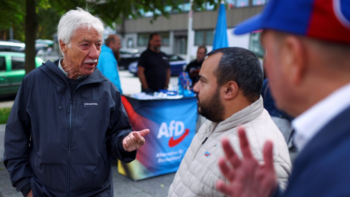 Norbert Emmerich, candidate for Gelsenkirchen mayor from the Alternative for Germany party (AfD), talks to AfD members as he campaigns on the streets ahead of the runoff of the North Rhine-Westphalian (NRW) local elections, Gelsenkirchen, Germany, Sept. 24, 2025. (Reuters Photo)