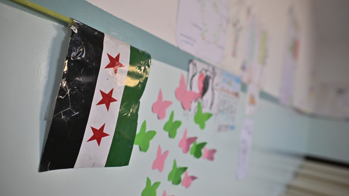 The flag of the Syrian revolution lies in a classroom of a boys' school in the Zebdin district, Damascus, Syria, Jan. 15, 2025. (Getty Images)