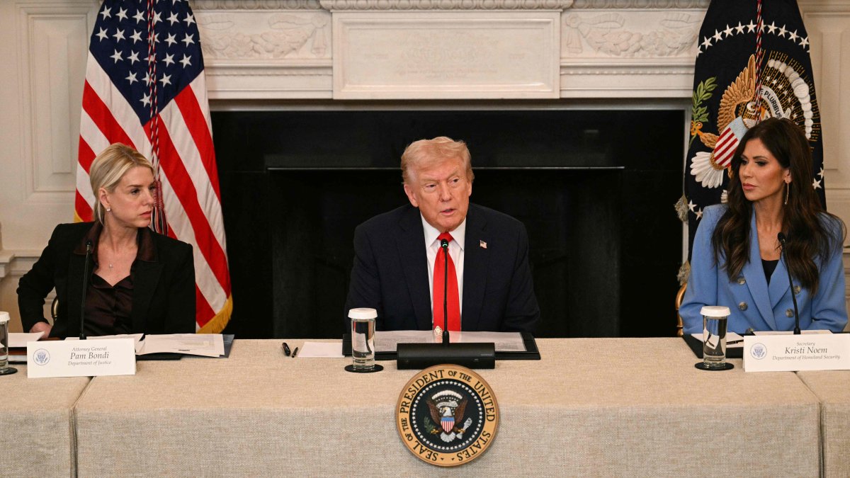 U.S. President Donald Trump, flanked by Attorney General Pam Bondi and Homeland Security Secretary Kristi Noem, speaks during a roundtable about Antifa in the State Dining Room of the White House in Washington, D.C., Oct. 8, 2025. (AFP Photo)