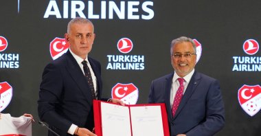 Turkish Football Federation (TFF) President İbrahim Hacıosmanoğlu (L) and Turkish Airlines (THY) Chair Ahmet Bolat pose for a photo after signing a new three-year deal, Istanbul, Türkiye, Oct. 7, 2025. (AA Photo)