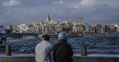 People enjoy the view of the famed Galata Tower, Istanbul, Türkiye, Sept. 26, 2025. (AA Photo)