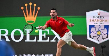 Serbia&#039;s Novak Djokovic hits a return to Spain&#039;s Jaume Munar during their men&#039;s singles match at the Shanghai Masters tennis tournament, Shanghai, China, Oct. 7, 2025. (AFP Photo)