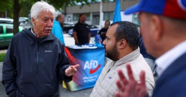 Norbert Emmerich, candidate for Gelsenkirchen mayor from the Alternative for Germany party (AfD), talks to AfD members as he campaigns on the streets ahead of the runoff of the North Rhine-Westphalian (NRW) local elections, Gelsenkirchen, Germany, Sept. 24, 2025. (Reuters Photo)