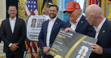 U.S. President Donald Trump (2nd R) is presented a novelty ticket by FIFA President Gianni Infantino during an announcement about the 2026 World Cup with Vice President JD Vance and Special Envoy Richard Grenell in the Oval Office at the White House, Washington, U.S., Aug. 22, 2025. (Getty Images Photo)