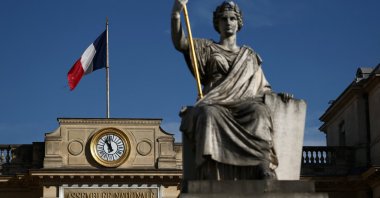 A French flag flies on the National Assembly, Paris, France, Oct. 7, 2025. (Reuters Photo)