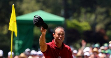 Tiger Woods acknowledges the crowd on the green on the 18th hole after completing his final Masters round at the Augusta National Golf Club, Augusta, Georgia, U.S., April 14, 2024. (Reuters Photo)