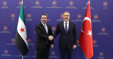  Foreign Minister Hakan Fidan and Syrian Foreign Minister Asaad Hassan al-Shibani pose for a photograph before their meeting in Ankara, Oct. 8, 2025. (EPA Photo)