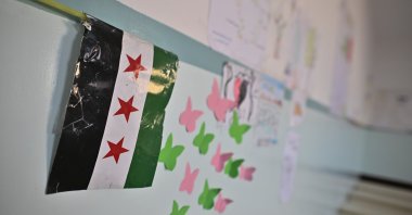 The flag of the Syrian revolution lies in a classroom of a boys&#039; school in the Zebdin district, Damascus, Syria, Jan. 15, 2025. (Getty Images)