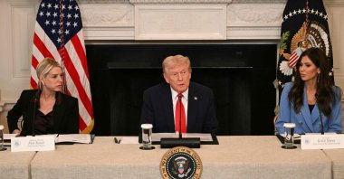 U.S. President Donald Trump, flanked by Attorney General Pam Bondi and Homeland Security Secretary Kristi Noem, speaks during a roundtable about Antifa in the State Dining Room of the White House in Washington, D.C., Oct. 8, 2025. (AFP Photo)