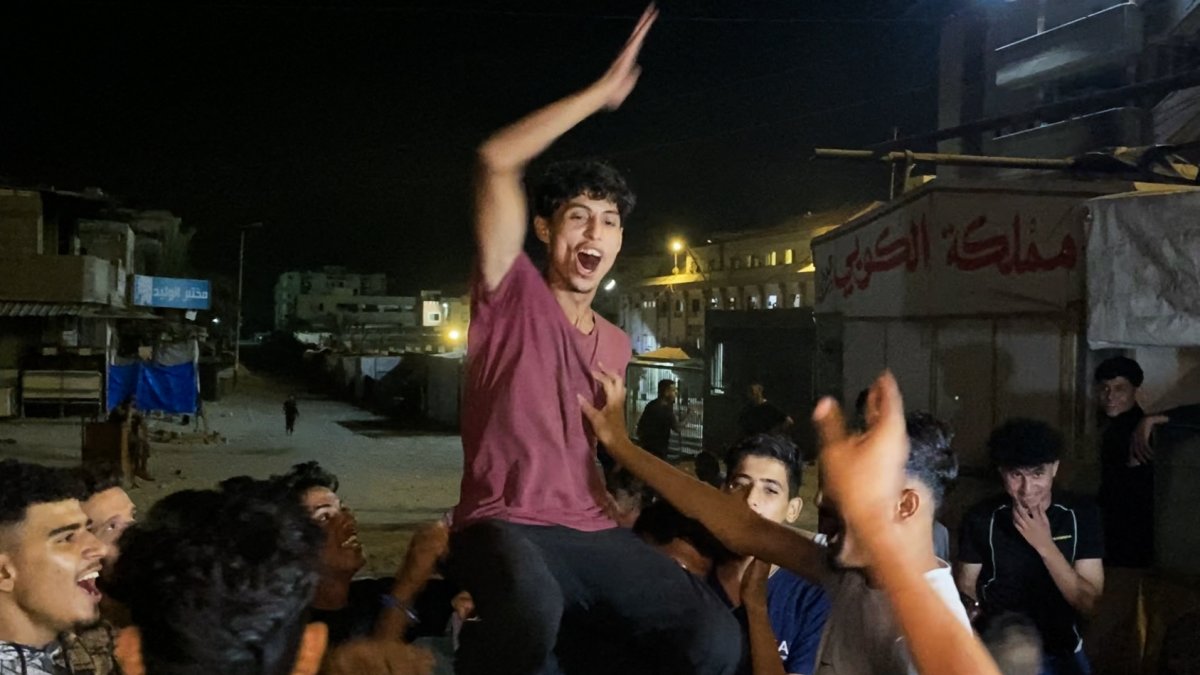 Palestinians celebrate following news of a new Gaza cease-fire deal, in Khan Yunis, southern Gaza Strip, Palestine, Oct. 9, 2025. (AFP Photo)