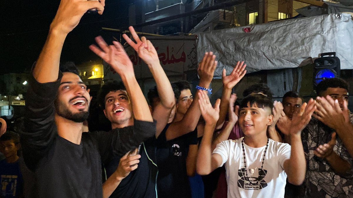 Palestinians celebrate following the news of a Gaza cease-fire deal, in Khan Younis, Oct. 9, 2025. (AFP Photo)