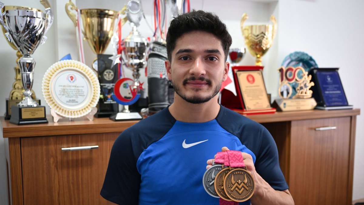 Turkish weightlifter Muhammed Furkan Özbek poses for a photo with his medals, Ankara, Türkiye, Oct. 8, 2025. (AA Photo)